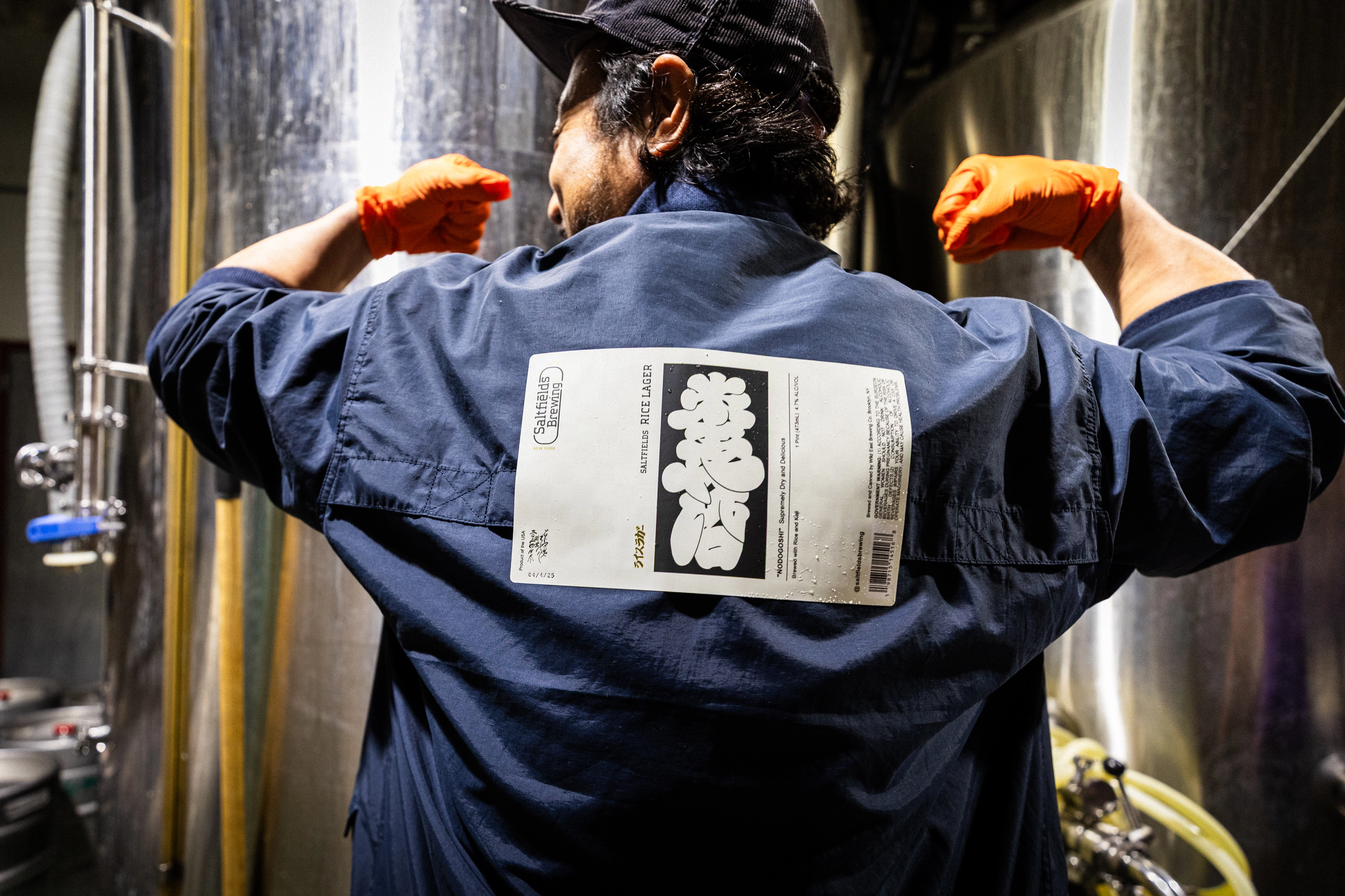 A Saltfields team member wearing can packaging on their jacket