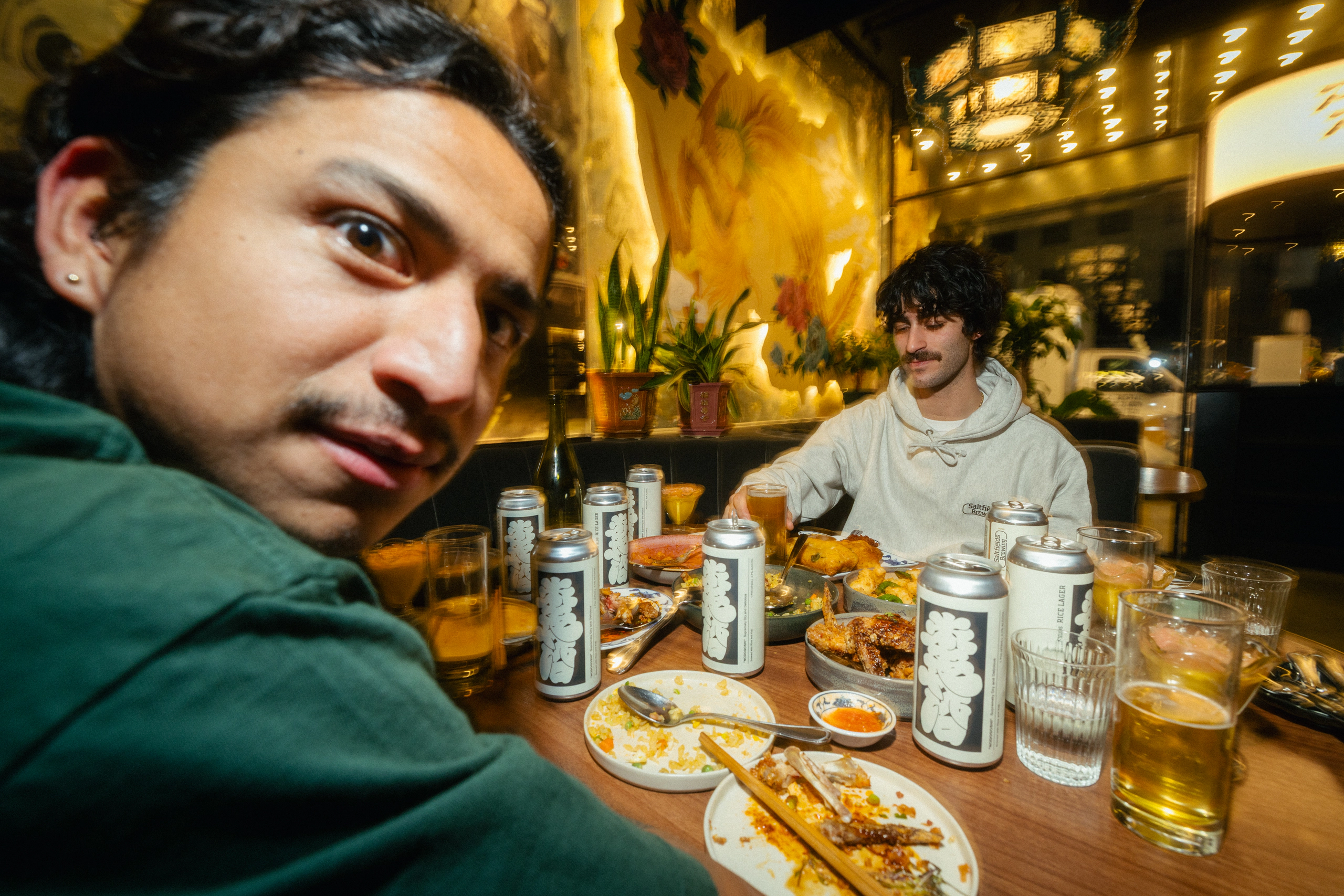 Friends sharing food and Saltfields beer