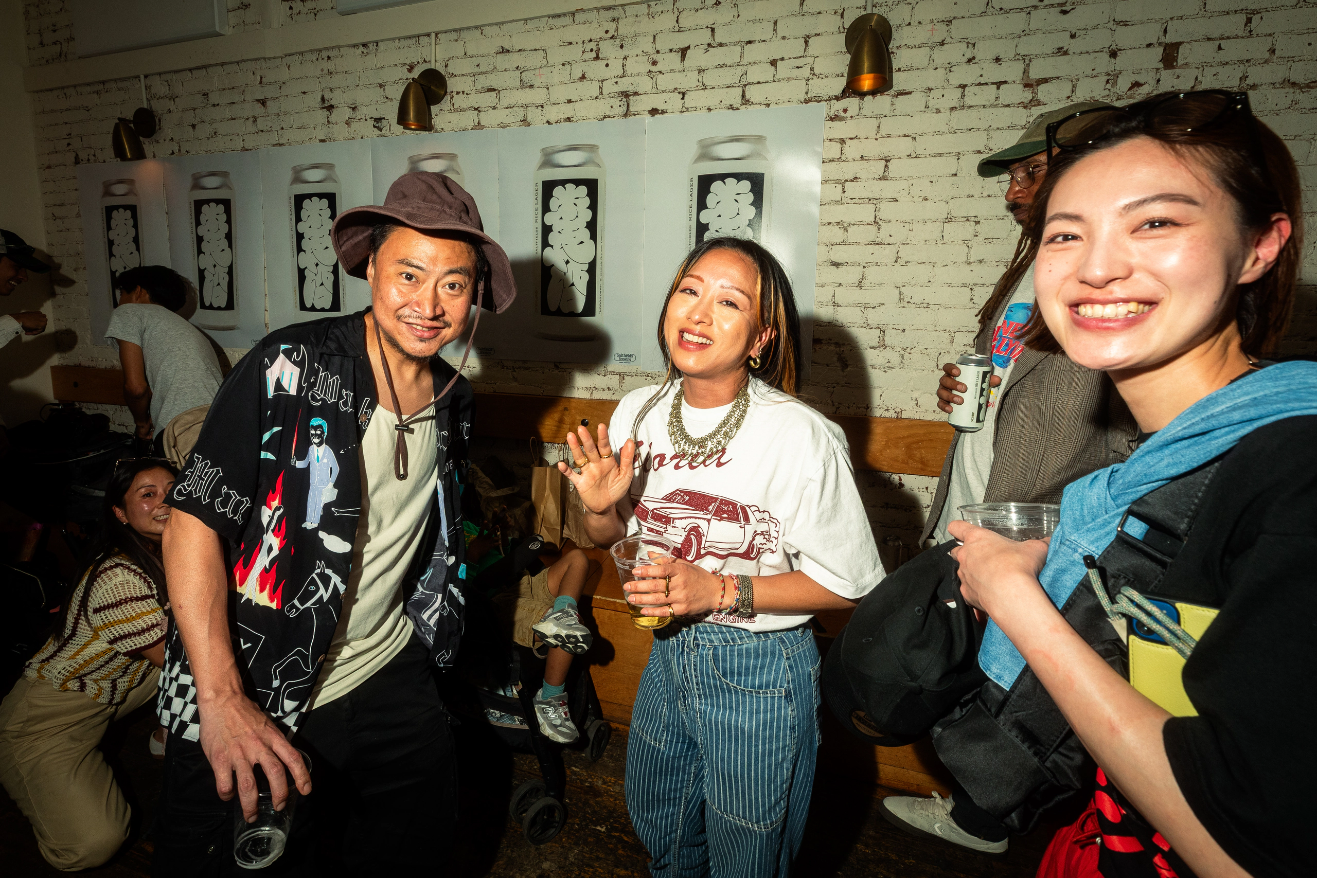 Three guests smiling at the Saltfields launch party