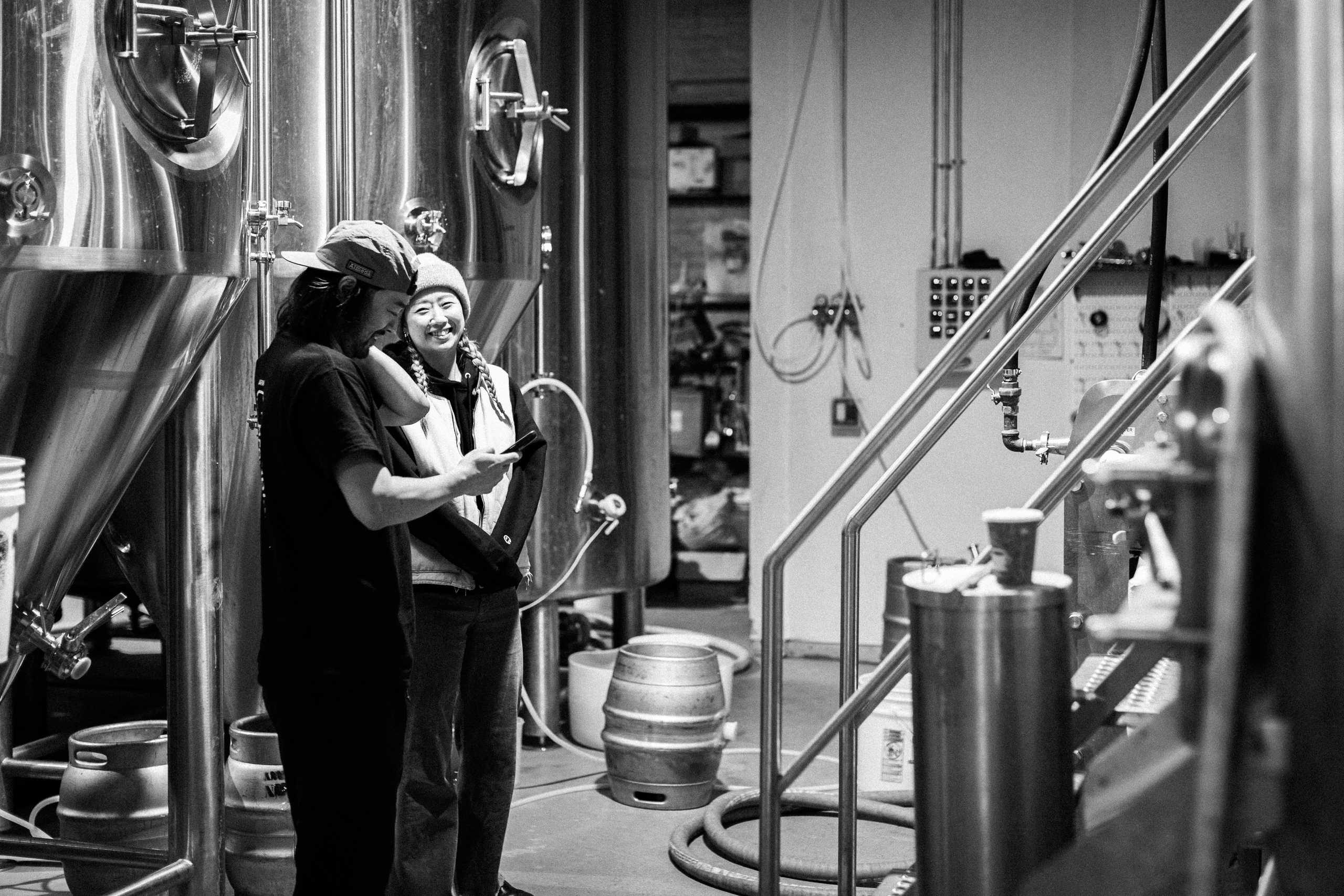 Two Saltfields team members embracing in the brewhouse